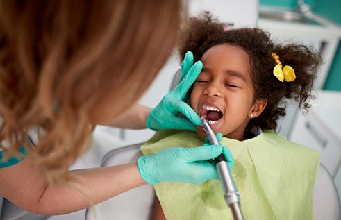 Young girl receiving a dental exam