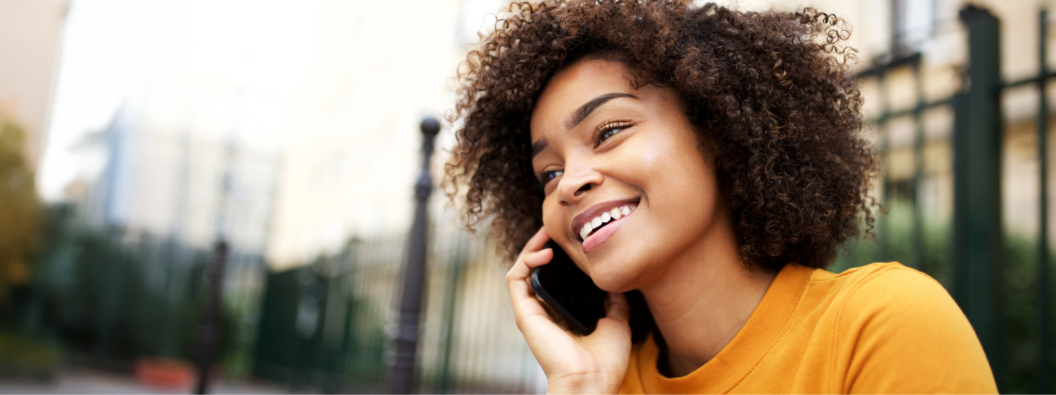 Young woman talking on the phone to request a dental appointment in Lillington